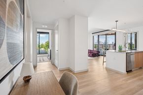 Atlanta apartment for rent - A modern kitchen with a dining table and chairs.
