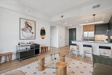 Atlanta apartment for rent - A modern living room with a white sofa and a coffee table.