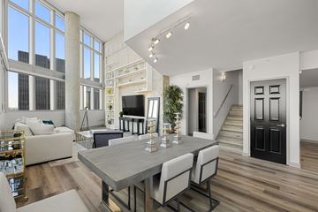 Los Angeles apartment for rent - A modern living room with a dining table and chairs.