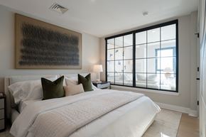 Philadelphia apartment for rent - a bedroom with a large bed and a large window
