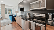 Denver apartment for rent - A modern kitchen with a stainless steel oven and microwave.
