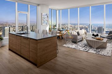 San Diego apartment for rent - A modern kitchen with a wooden island and a view of the city.