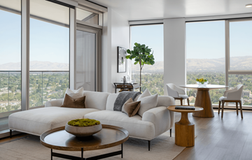 San Jose apartment for rent - a living room with a white couch and views of the city and mountains