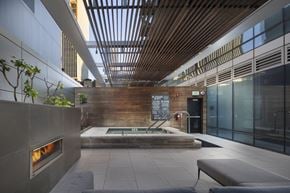 San Francisco apartment for rent - A modern indoor space with a fireplace and a pool.
