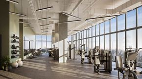 Houston apartment for rent - A modern office space with a long row of chairs and a row of motorcycles.