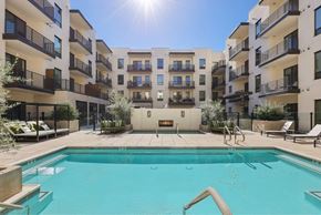 Scottsdale apartment for rent - A swimming pool in front of apartment buildings.