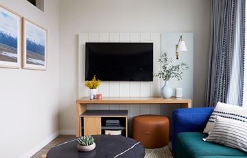 Seattle apartment for rent - A living room with a black table and a blue couch.