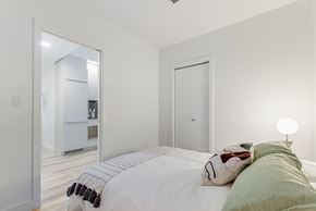 Montréal apartment for rent - a bedroom with a bed and a mirror