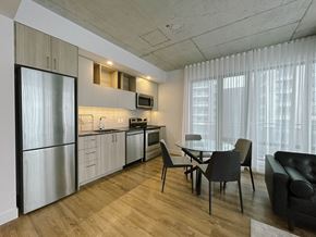 Montreal apartment for rent - a kitchen and dining room with a table and chairs