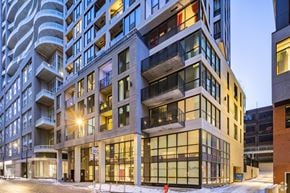 Montreal apartment for rent - a view of a building on a city street at dusk