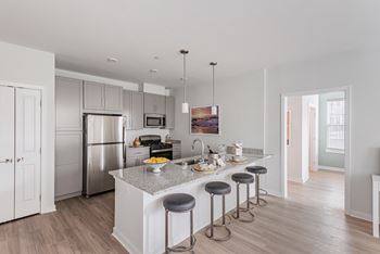 Chef-inspired kitchens with stainless-steel appliances, granite countertops and tile backsplash