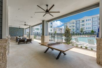 Summer kitchen with outdoor ping pong table