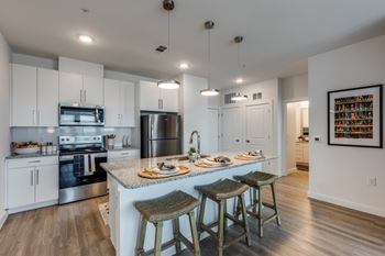 Chef-inspired kitchens with white cabinetry and granite countertops