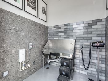 The kitchen has a large stainless steel stove in the corner of the room