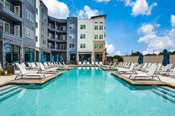 Resort-style pool deck with cabanas