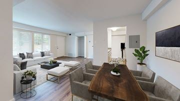 Bladensburg apartment for rent - a living room with couches and a table
