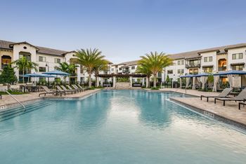 Resort-style pool with waterfall