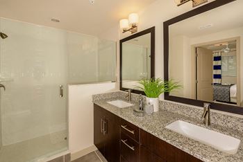 Bathrooms featuring granite counters & glass showers or soaking tubs