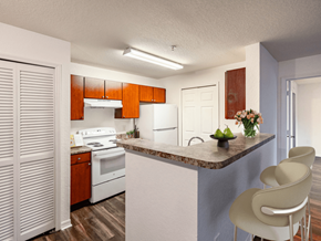 Melbourne apartment for rent - A kitchen with a white counter top and a white stove.