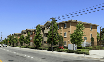 Anaheim apartment for rent - a row of apartment buildings on the side of a street
