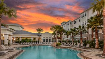 Tropical pool with waterfall, spa, covered lanai & cabanas 