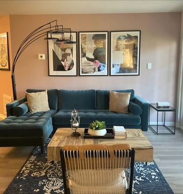 Frederick apartment for rent - a living room with a blue couch and a coffee table
