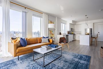 North Hollywood apartment for rent - a living room with a brown couch and a coffee table