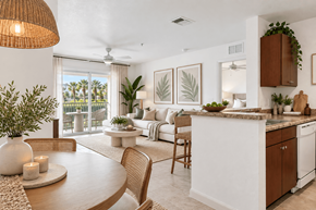 Leesburg apartment for rent - A well-lit, modern kitchen and dining area with a table set for two.