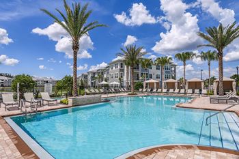 Resort-style pool with poolside cabanas