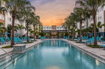 Resort-inspired swimming pool with covered cabanas