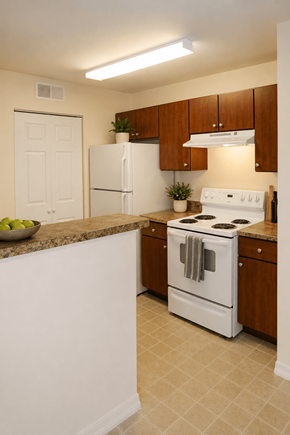 Brandon apartment for rent - A white stove and refrigerator in a kitchen with brown cabinets.