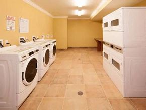 Tinton Falls apartment for rent - a laundry room filled with lots of white washing machines