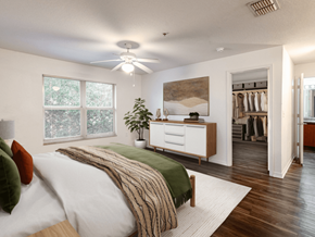 Melbourne apartment for rent - A bedroom with a bed, a dresser, and a ceiling fan.