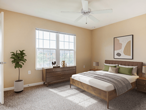 Zephyrhills apartment for rent - A bedroom with a bed, dresser, and ceiling fan.