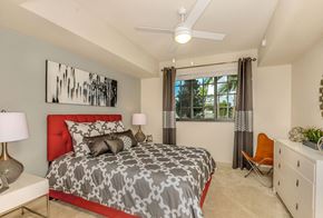 Davie apartment for rent - Bedroom with large window and a ceiling fan at Palm Ranch Apartments in Davie, FL