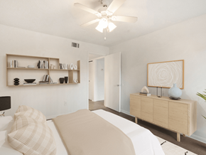 Melbourne apartment for rent - A bedroom with a bed, a dresser, and a ceiling fan.