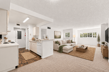 Homestead apartment for rent - A modern living room with a white kitchen area.
