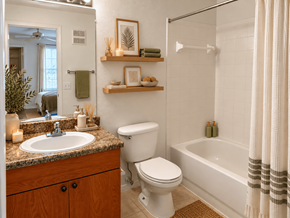Spring Hill apartment for rent - A bathroom with a white toilet, sink, and bathtub.