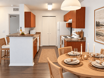 Spring Hill apartment for rent - A modern kitchen with a dining table set for two.