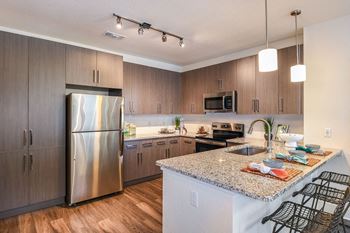 Chef-inspired kitchens with stainless steel appliances and granite countertops