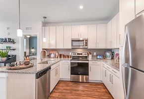 Tampa apartment for rent - Open kitchen with upscale finishes at The Foundry Luxury Apartments in Tampa FL