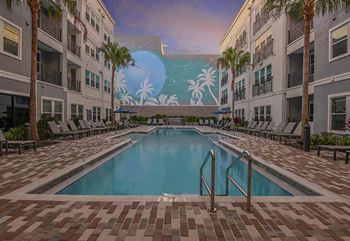Resort pool with waterfall & sun deck