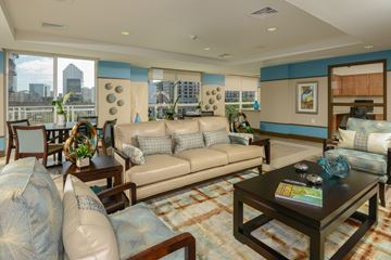 Miami apartment for rent - a living room with couches and a table