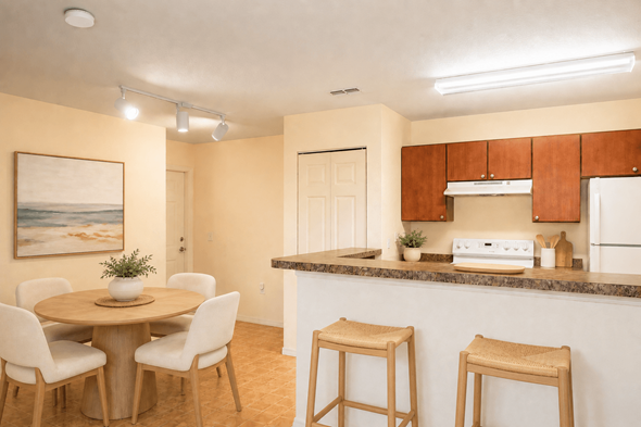 Largo apartment for rent - A kitchen with a table and chairs and a painting on the wall.