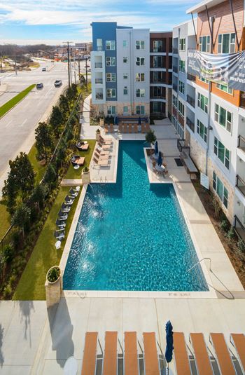 Resort-style pool with waterfall & sun deck
