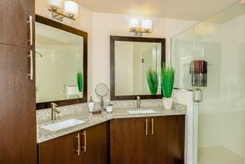 Dual vanities with granite counters in select master suites