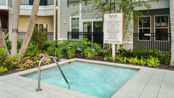 Resort-style pool with covered cabanas & heated spa