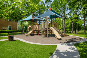 Largo apartment for rent - A playground with a blue canopy and a yellow slide.