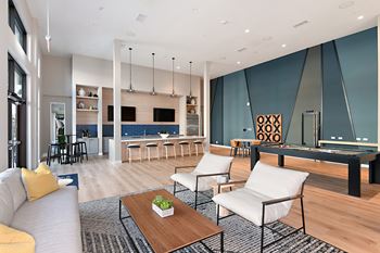 Chic clubhouse with demo kitchen, coffee bar & billiards