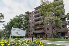 Barrie apartment for rent - Collier Terrace is a large apartment complex with a sign in front of it.